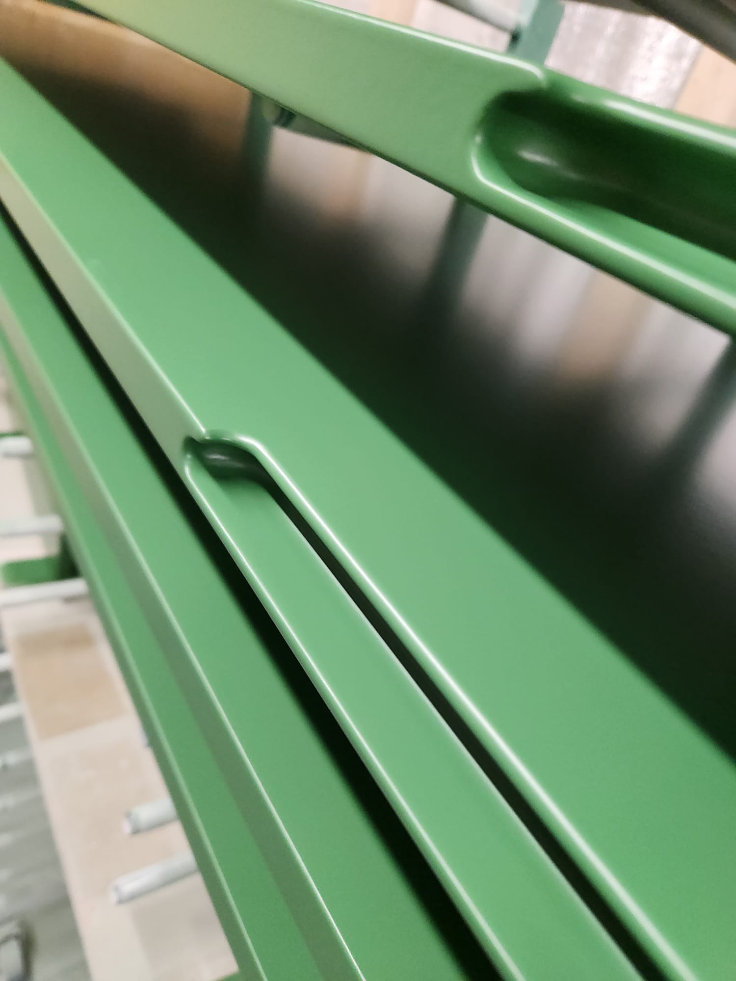 Close-up detail of a bespoke spray-painted cabinet handle with smooth satin finish